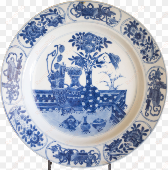 a chinese blue and white plate decorated with precious - blue and white porcelain