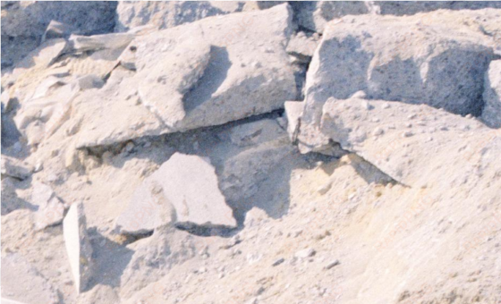 a technician measures a concrete area, which was blown - outcrop