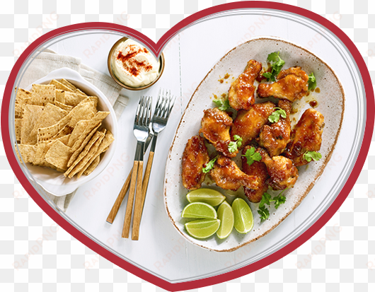 an image of maple glazed chicken wings in a bowl with - sesame chicken