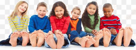 children sitting with feet showing - kids feet