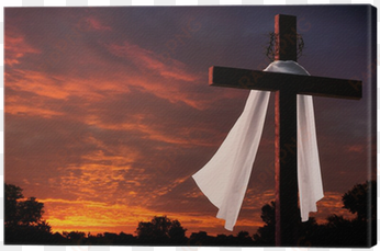 dramatic lighting on christian easter cross at sunrise - christianity