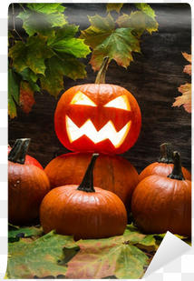 jack o lantern on pumpkins pile with leaves wall mural - stingy jack
