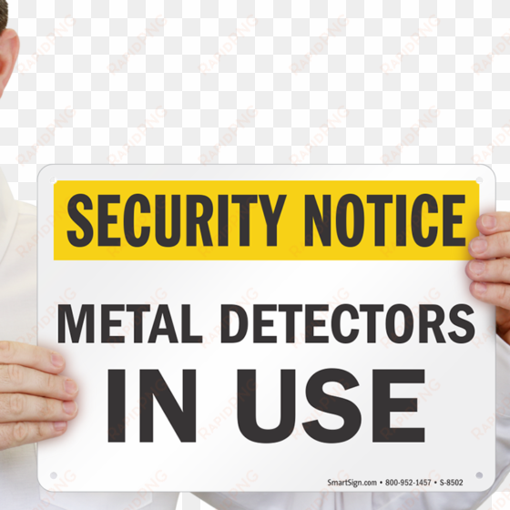 metal detectors in use sign - security notice video surveillance in use on these