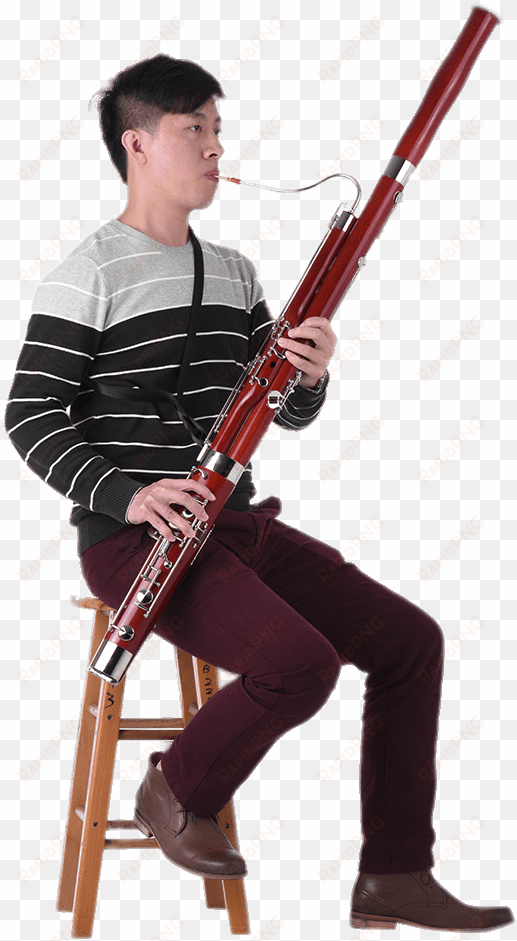 musician playing the bassoon - person playing bassoon