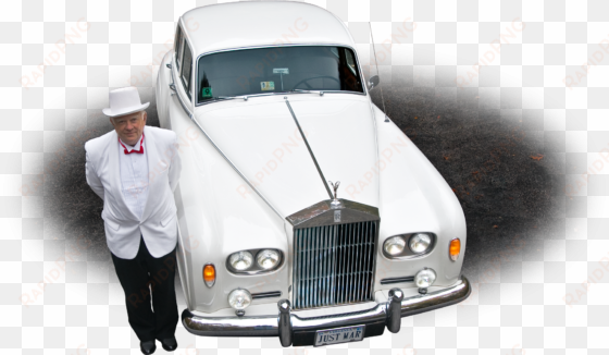 photo of a chauffeur in front of a white 1964 rolls-royce - rolls-royce corniche
