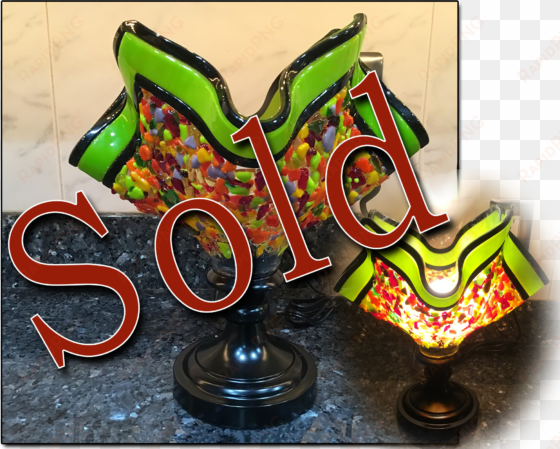 sold multi colored small torch lamp