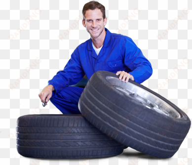 tire services tires done right - mechanic with tyre